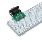 Back left view of DB9 female breadboard breakout partially on a breadboard